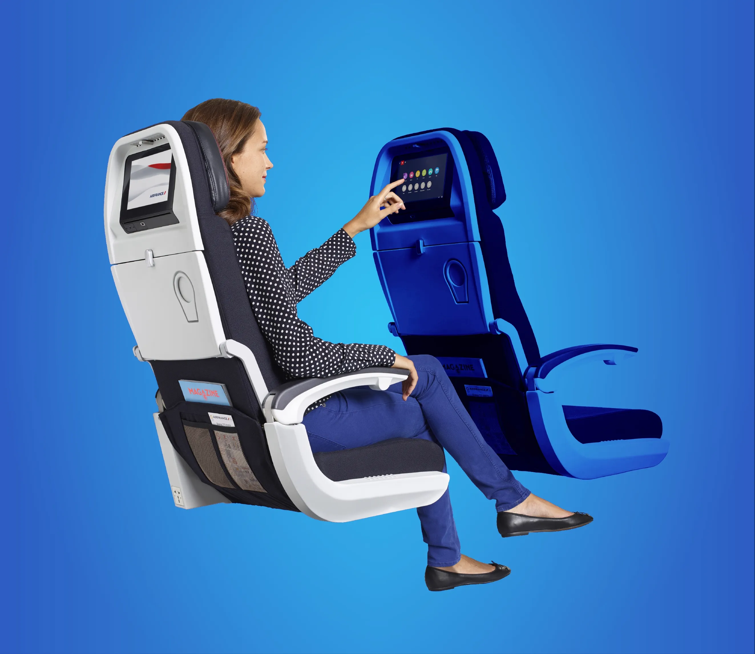 A passenger in an Air France seat tapping the seatback touchscreen of the seat ahead, the cabin experience
