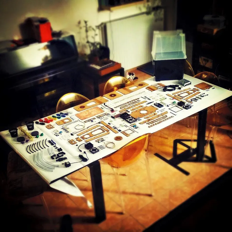 Every part of the greenhouse kit laid out flat on a table, showing how much a self-build owner assembles
